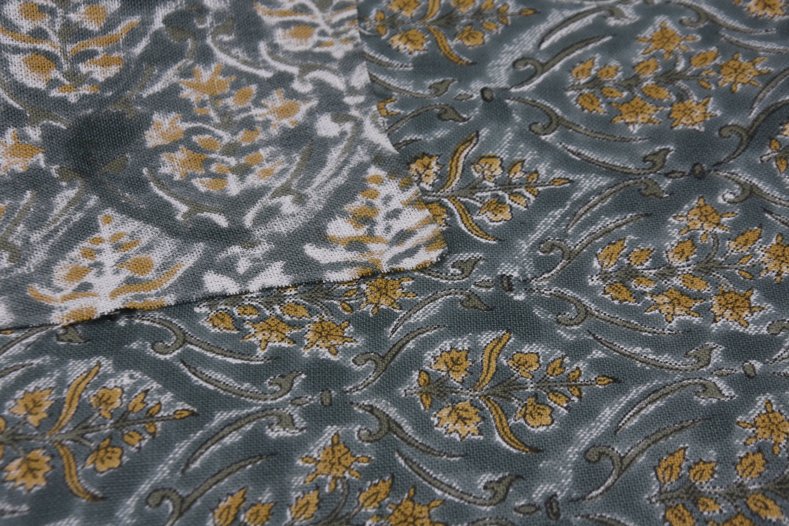 VISHAL PUSHP HAND BLOCK PRINTED FABRIC – THICK LINEN WITH LEAF PRINT IN GRAY & MUSTARD