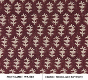 Black fabric bins with ivory mandala designs and leather tassels, ordered from big to small.