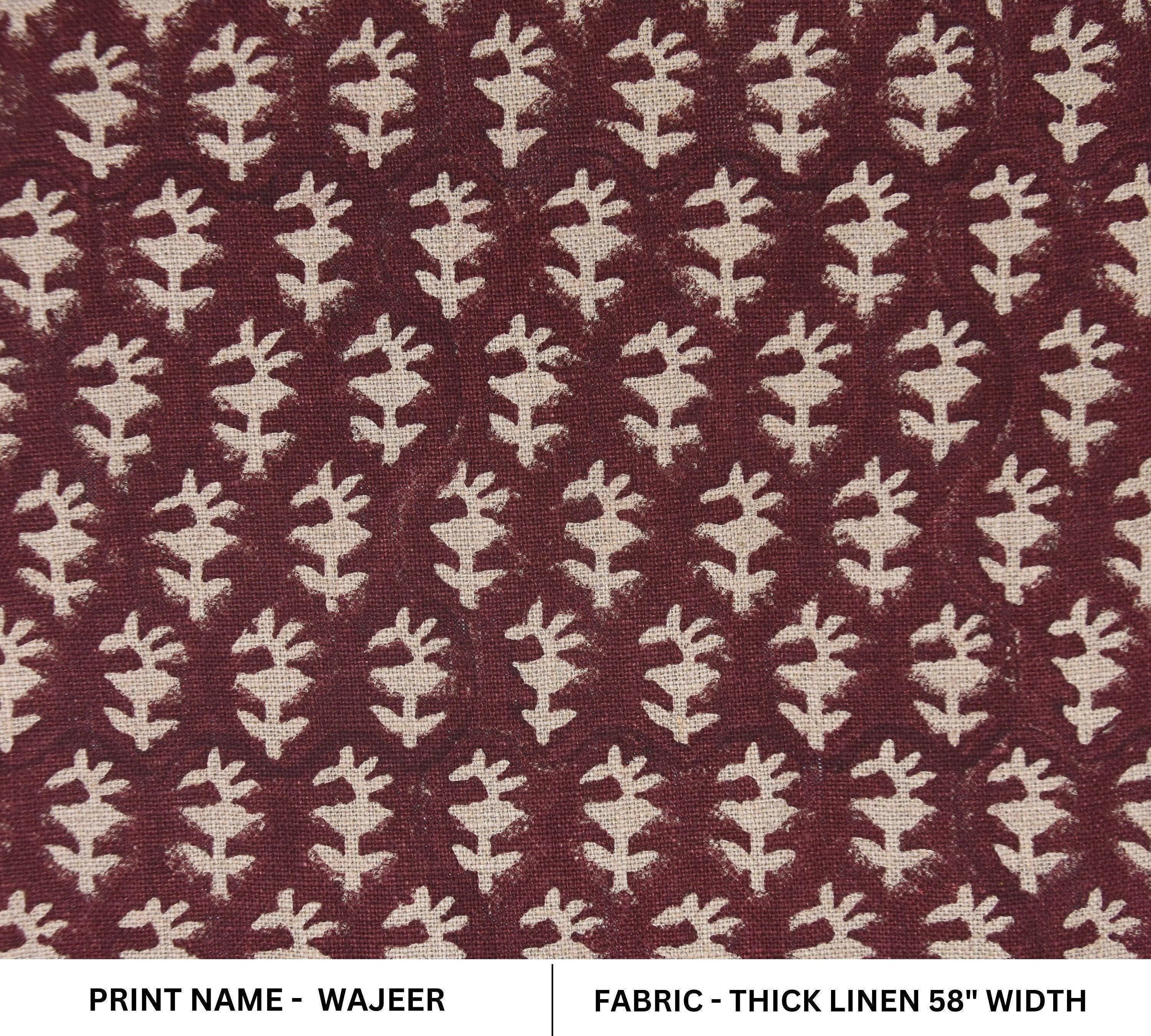 Black fabric bins with ivory mandala designs and leather tassels, ordered from big to small.