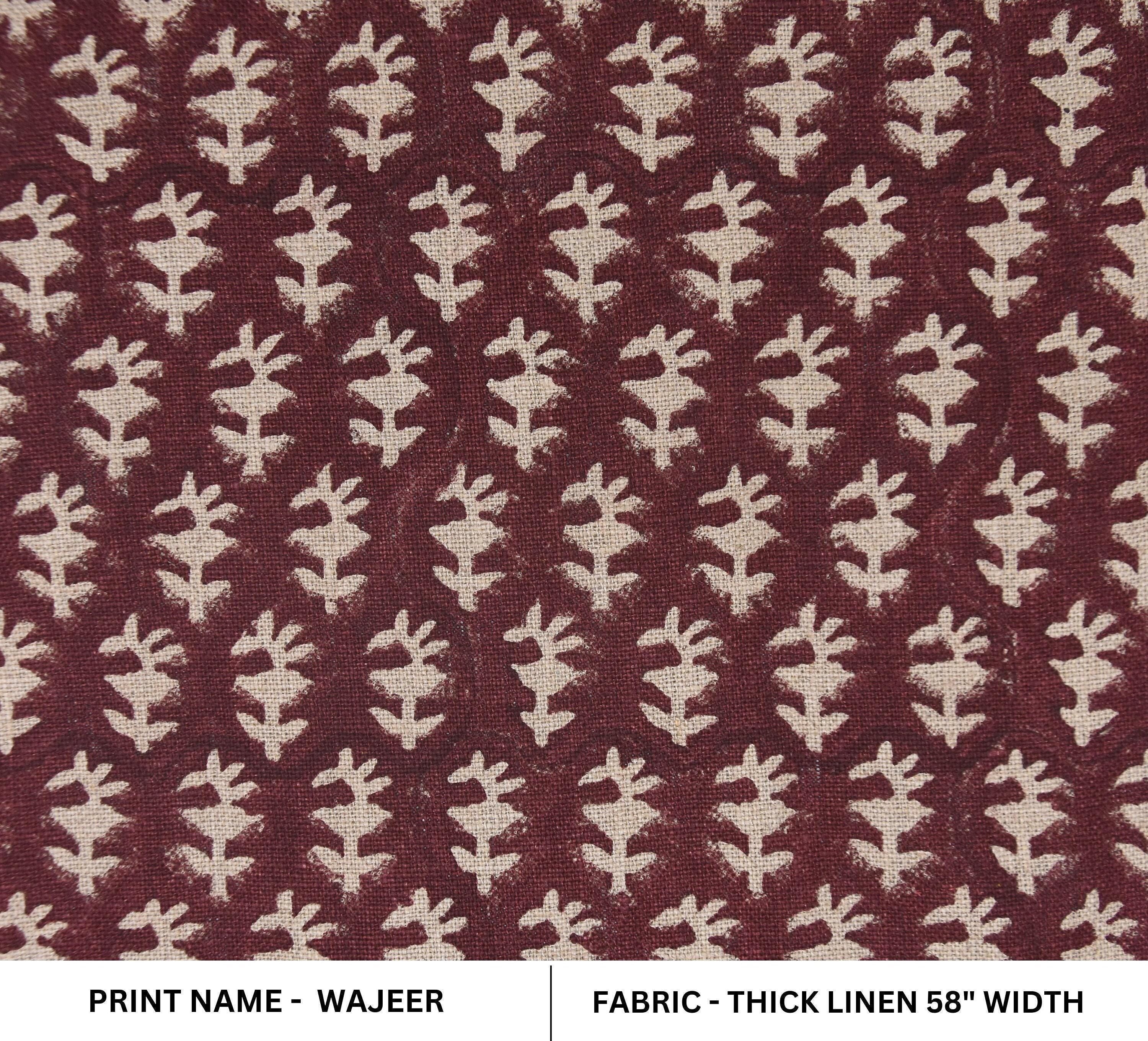 Black fabric bins with ivory mandala designs and leather tassels, ordered from big to small.