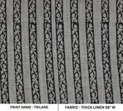 Patterned fabric with black and white design on a gray background