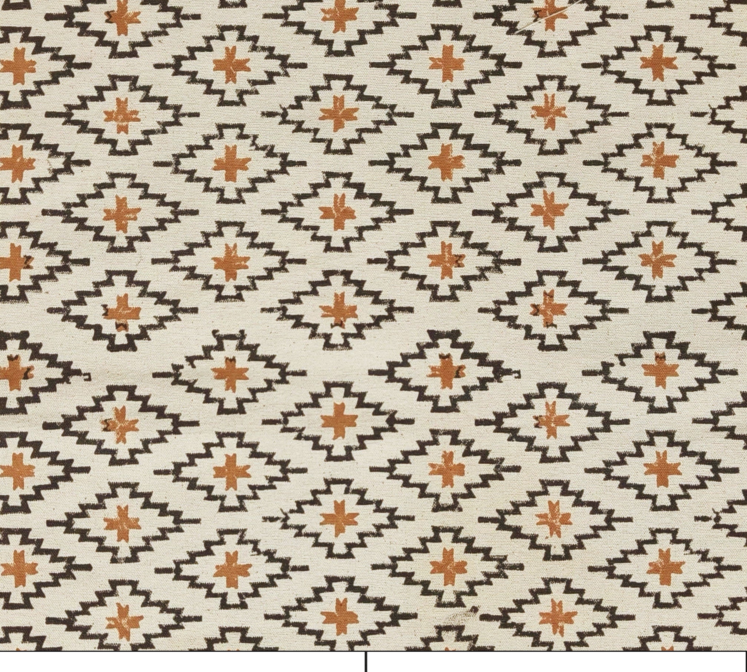 Patterned fabric with geometric design on a beige background