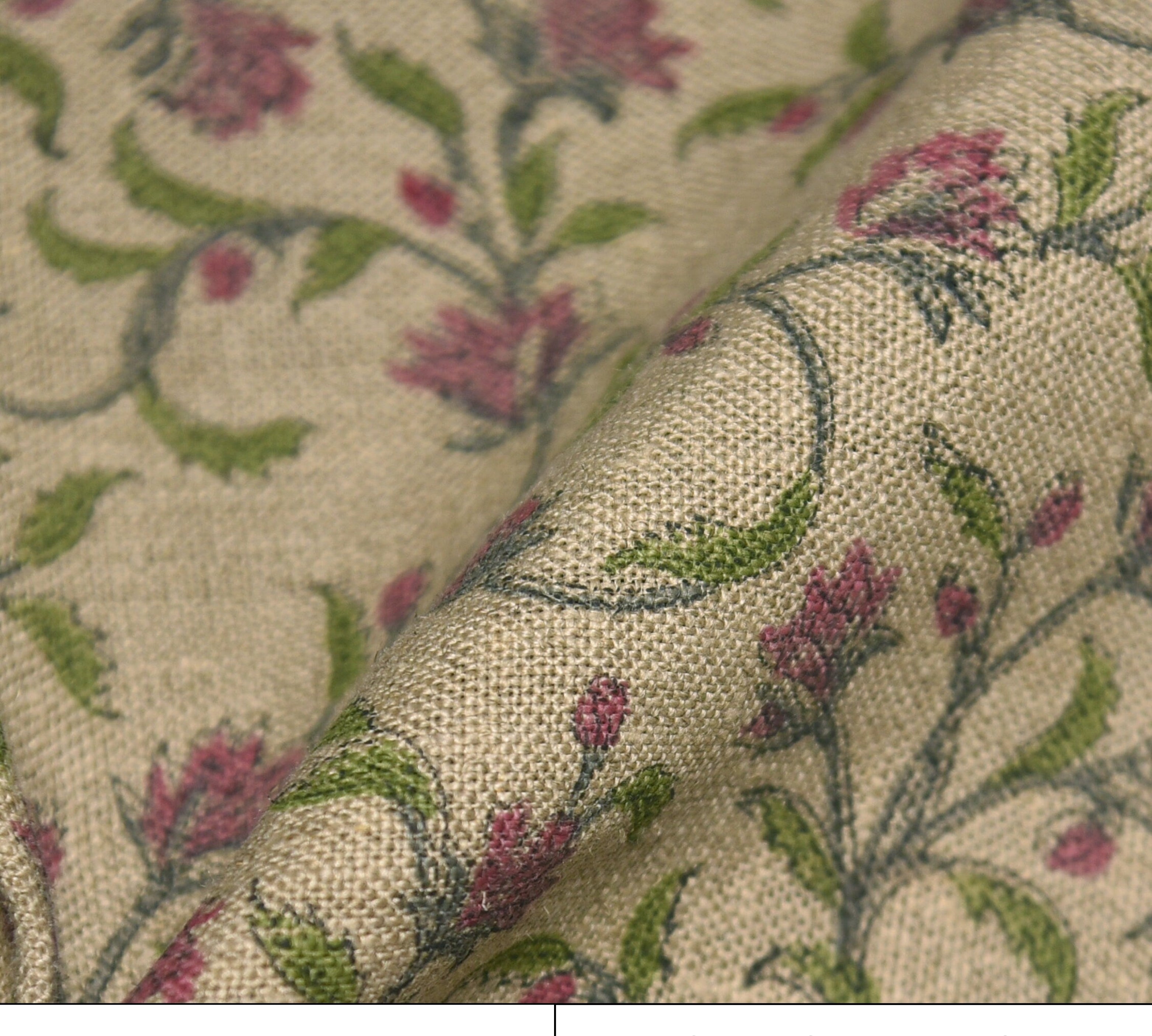 Floral patterned fabric with pink flowers and green leaves on a beige background