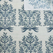 Patterned fabric with blue floral design on a white background
