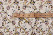 Floral patterned fabric with a ruler for scale on a white background