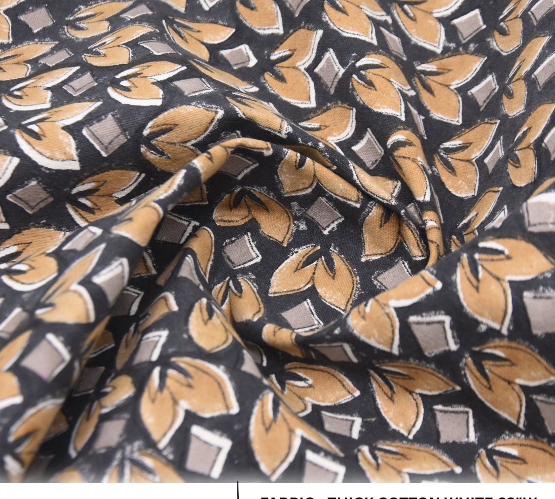 Close-up of fabric with a leaf pattern on a black background