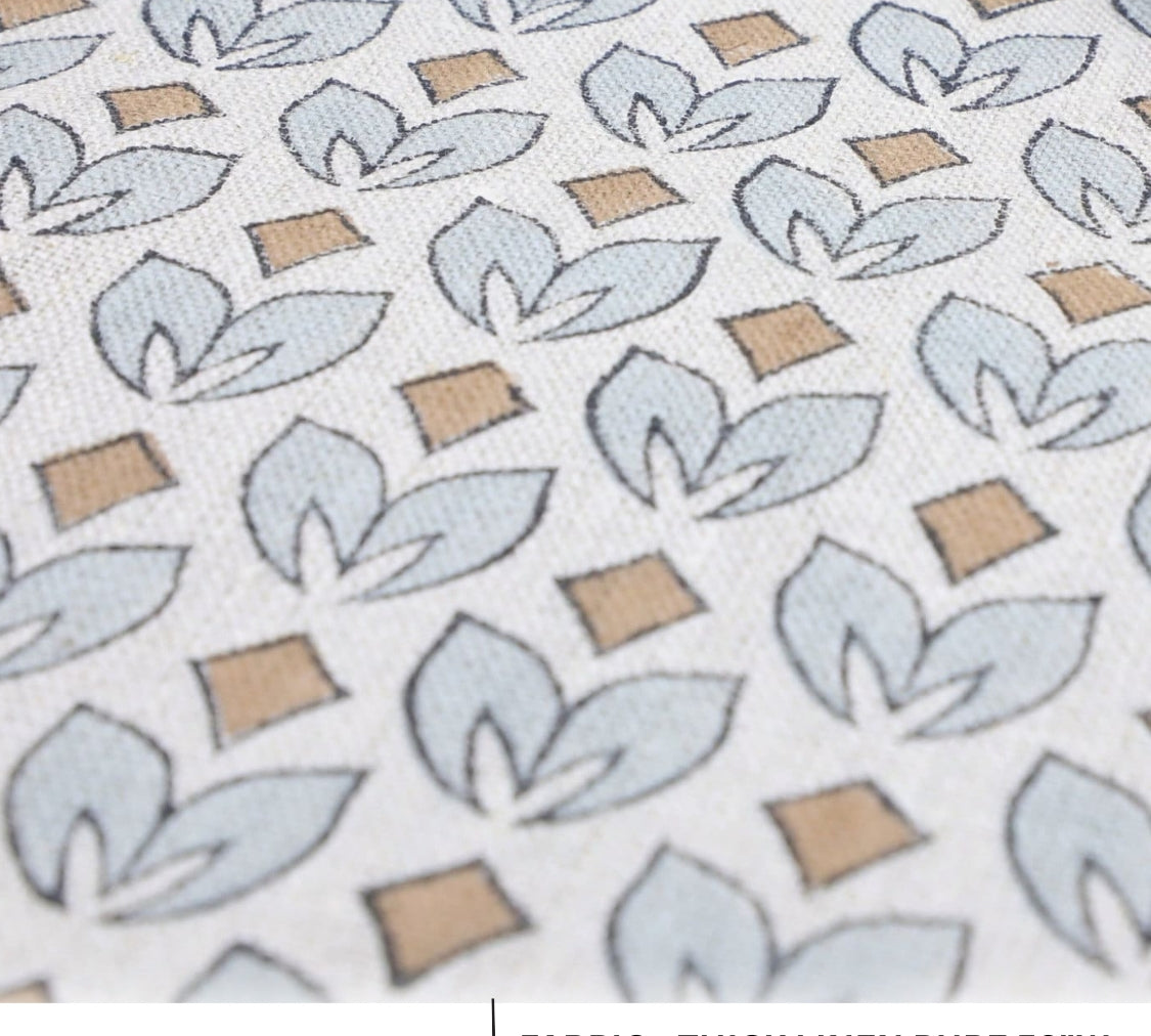 Patterned fabric with leaf design on a white background