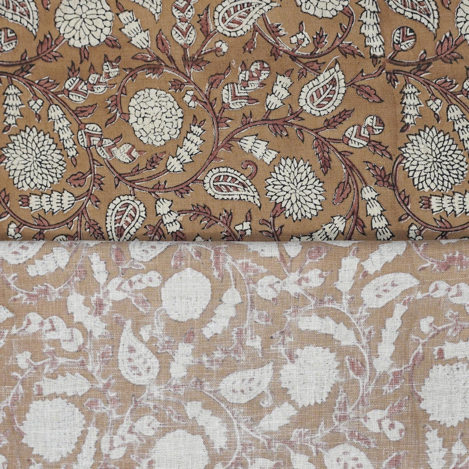 Indian handmade block printed brown fabric used for creating elegant pillow covers and drapes in a warm farmhouse living room.