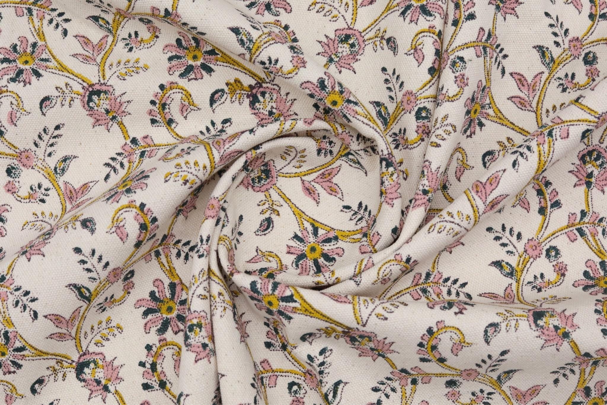 Floral patterned fabric with intricate designs on a white background