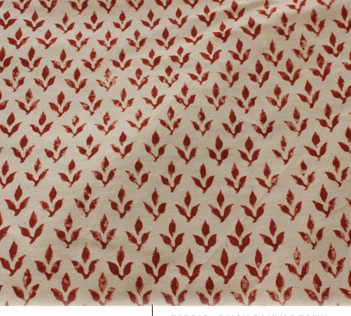 Duck canvas fabric with red leaf pattern, labeled 'Diya Baati'.