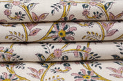 Stack of floral-patterned fabric swatches