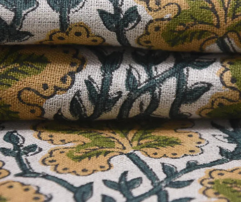 Close-up of thick linen patterned fabric with green and yellow floral design