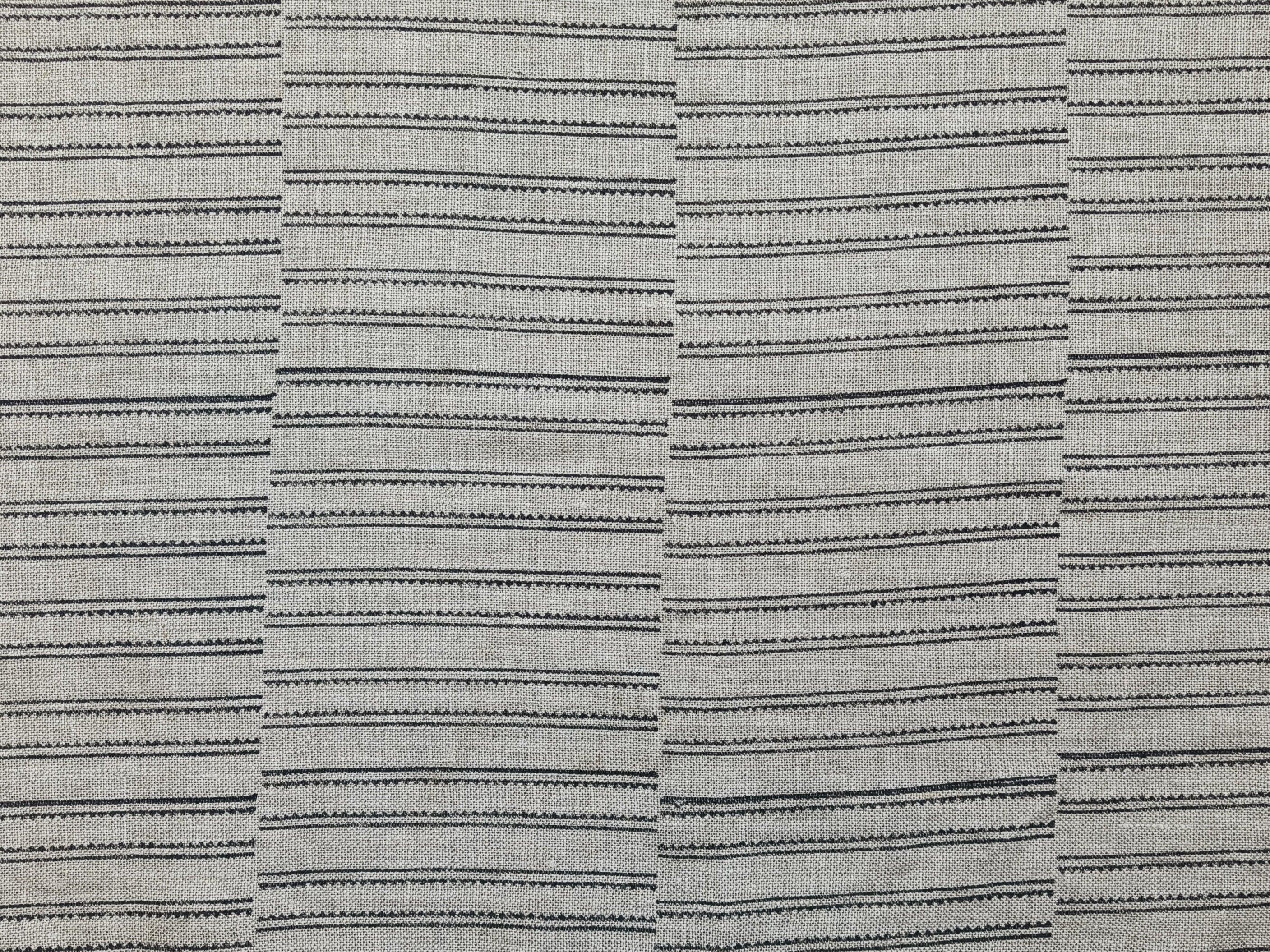 Zoomed-in image of BAIKUNTH's fabric featuring bold stripes