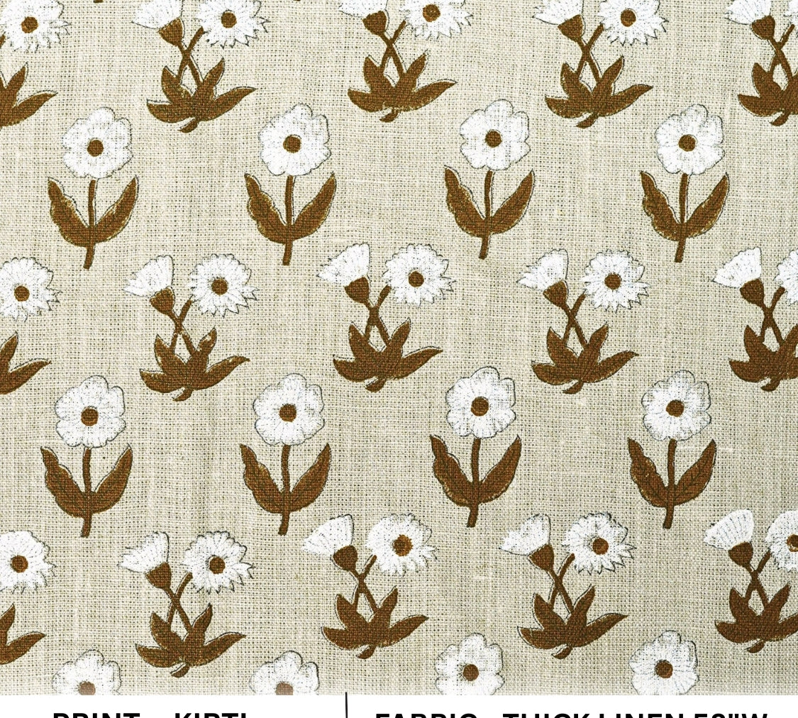 Patterned fabric with white flowers and brown leaves on a beige background