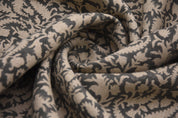 Close-up of patterned fabric with dark and light brown design