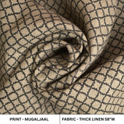 Rolled-up fabric with a geometric pattern on a beige background