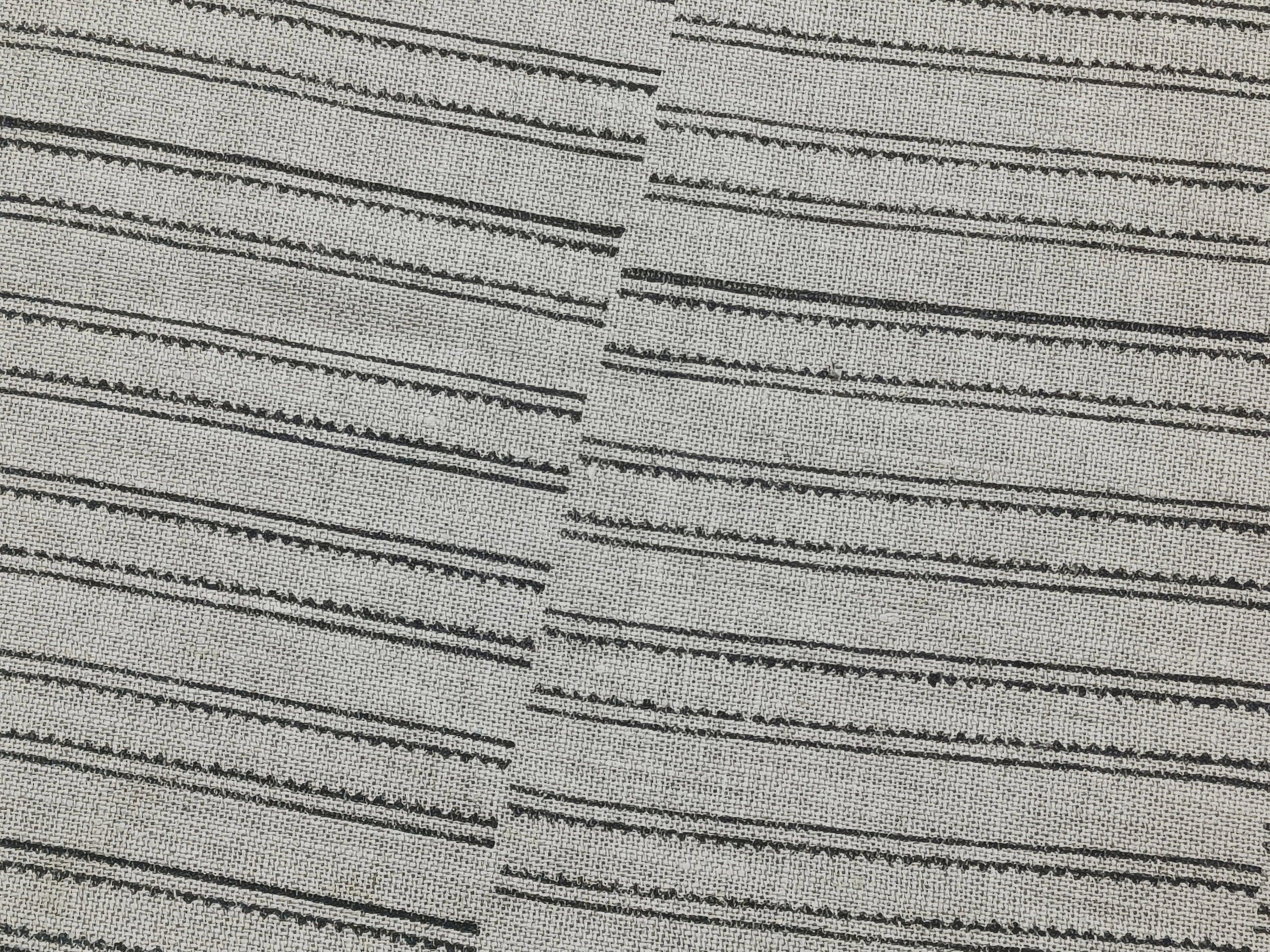 Close-up shot of BAIKUNTH's monochrome striped material