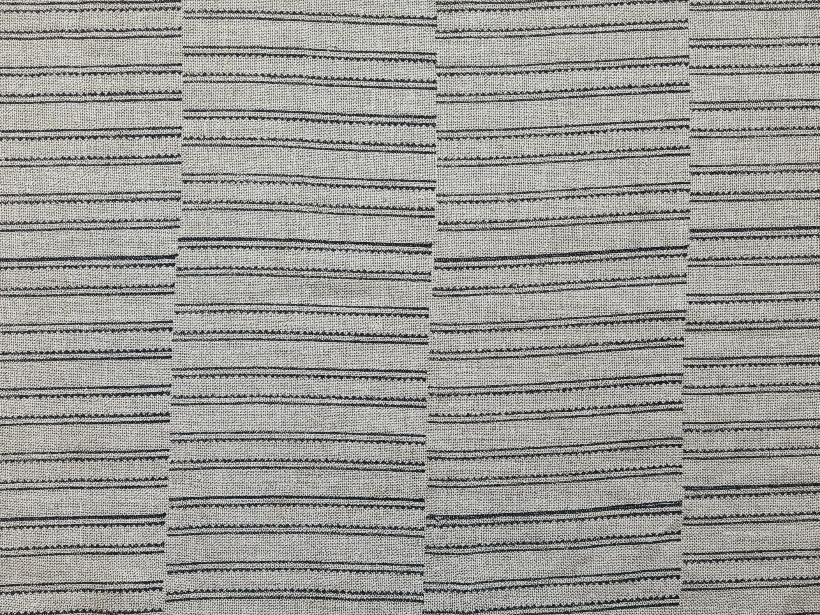 Zoomed-in image of BAIKUNTH's fabric featuring bold stripes