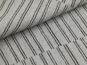 Macro shot of BAIKUNTH's signature black and white striped cloth